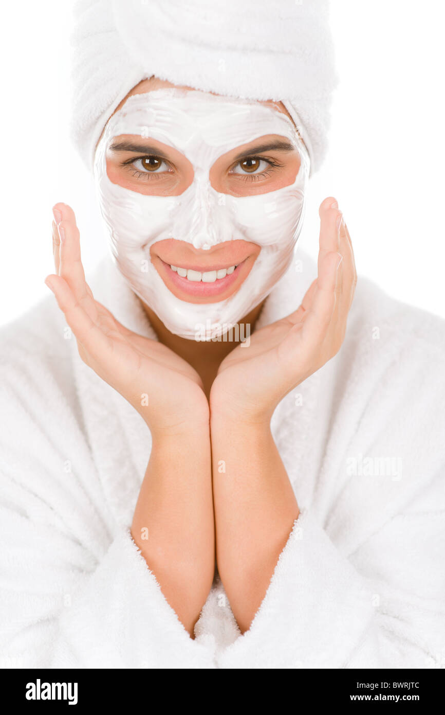 Teenager facial mask - happy woman on white background Stock Photo