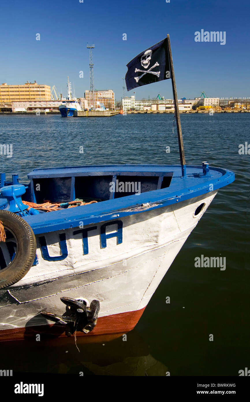 the smal boat with black jack in port - Gdynia - Poland Stock Photo