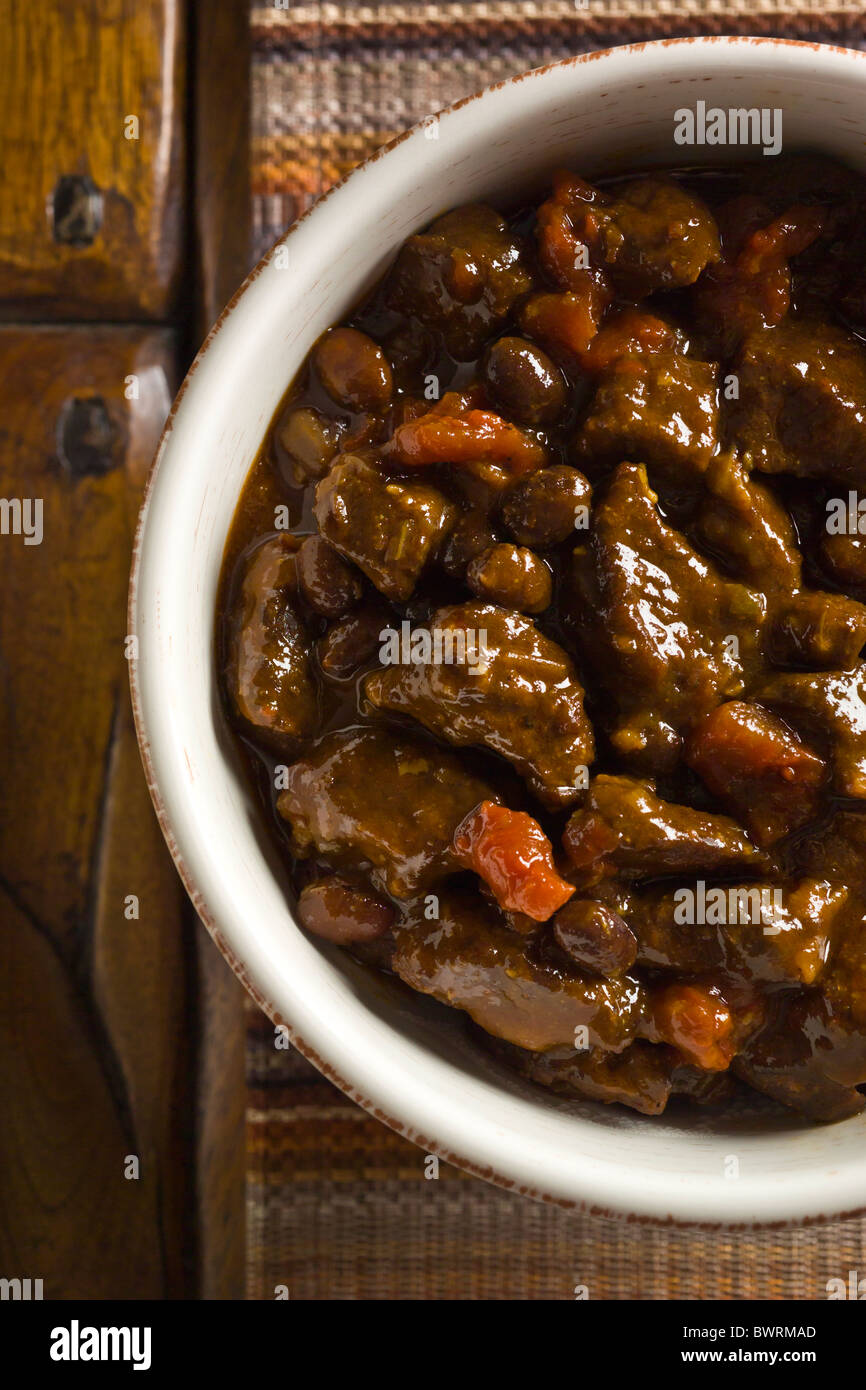 A bowl of Beef and Black Bean Chili with Toasted Cumin Crema on a