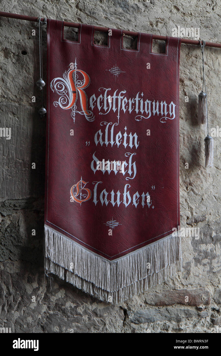 'Rechtfertigung allein durch Glauben', justification by faith alone, flag in the great hall, Burg Hardeg palace Stock Photo