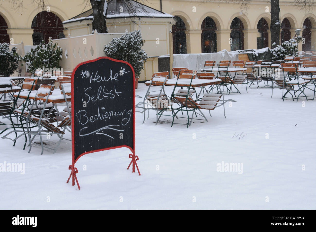 Snowy Street Cafe in Munich Stock Photo