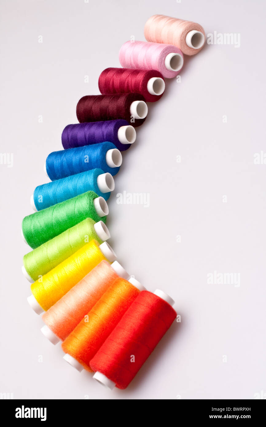multicolored rainbow threads for sewing Stock Photo Alamy