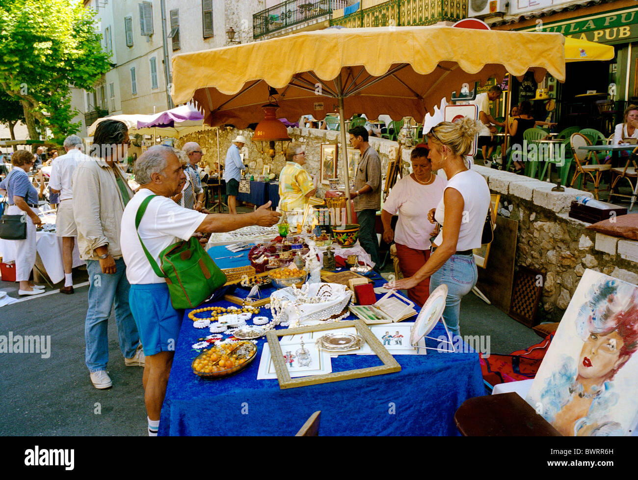 The street market in Antibes on the French Riviera is a great place to browse for antiques and bric-a-brac (brocante) Stock Photo