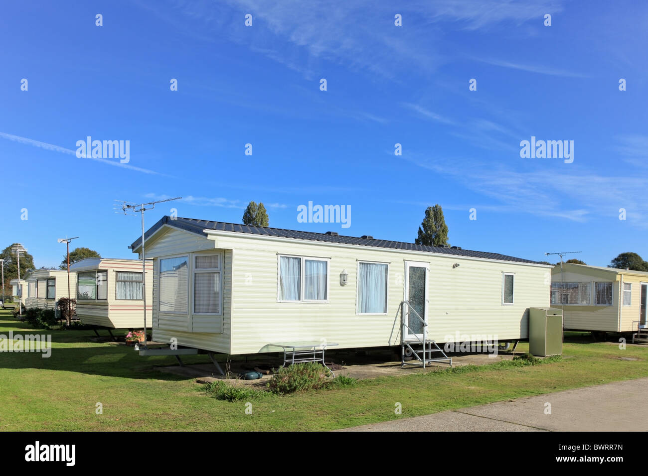 Caravan holiday homes sited on a caravan park in the summer. Stock Photo