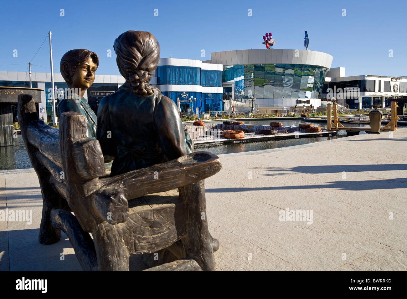 Bronze sculpture, in the back an ice rink and Culturama in a tourist area in Sharm el Sheikh, Egypt, Africa Stock Photo
