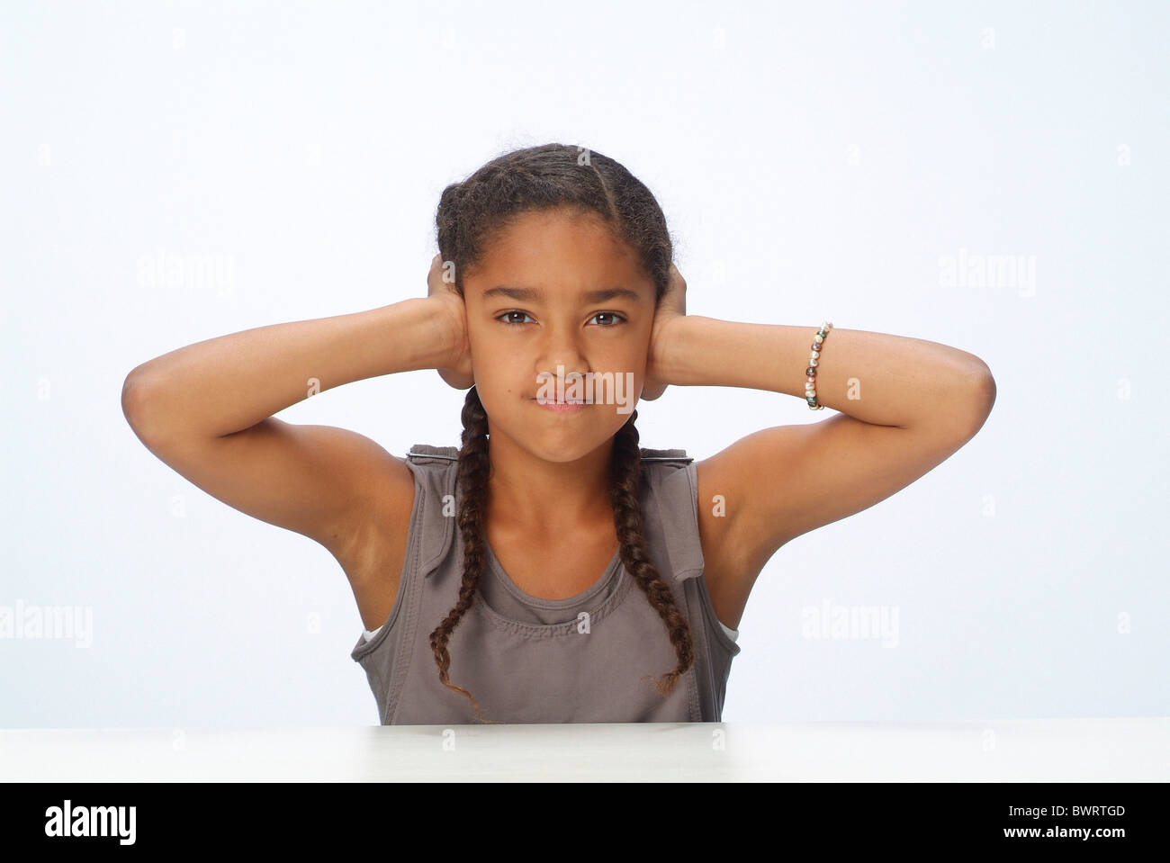 Portrait of a girl covering her ears Stock Photo Alamy