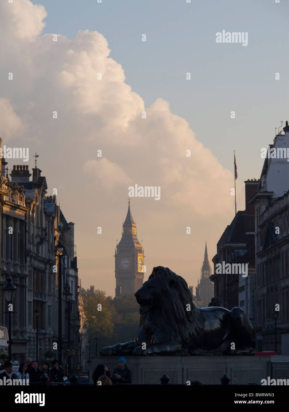 A view of Big Ben looking past one of the lions in Trafalgar Sq, London Stock Photo