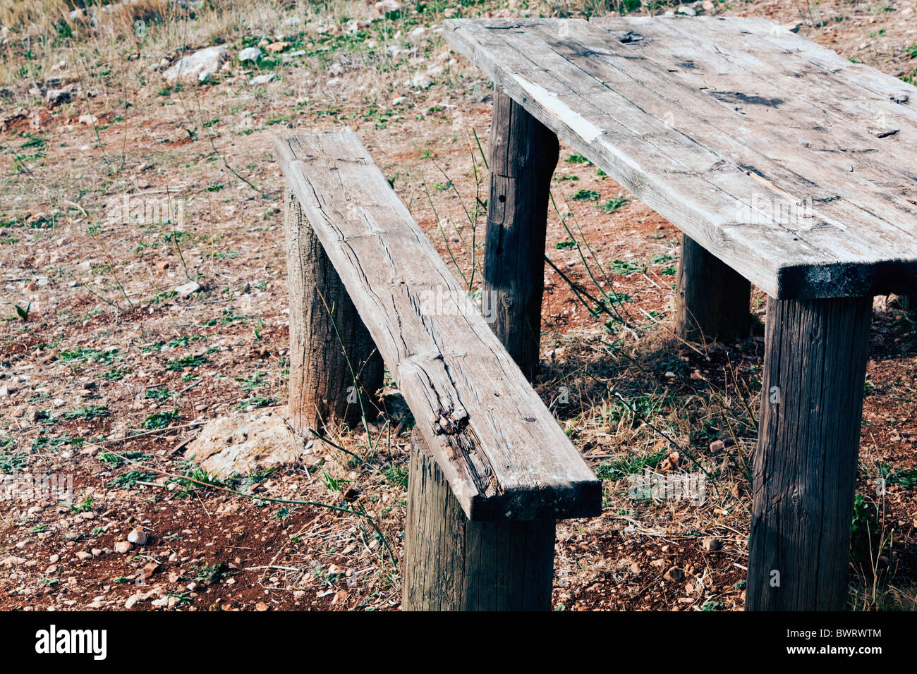 Old broken picnic bench and table Stock Photo