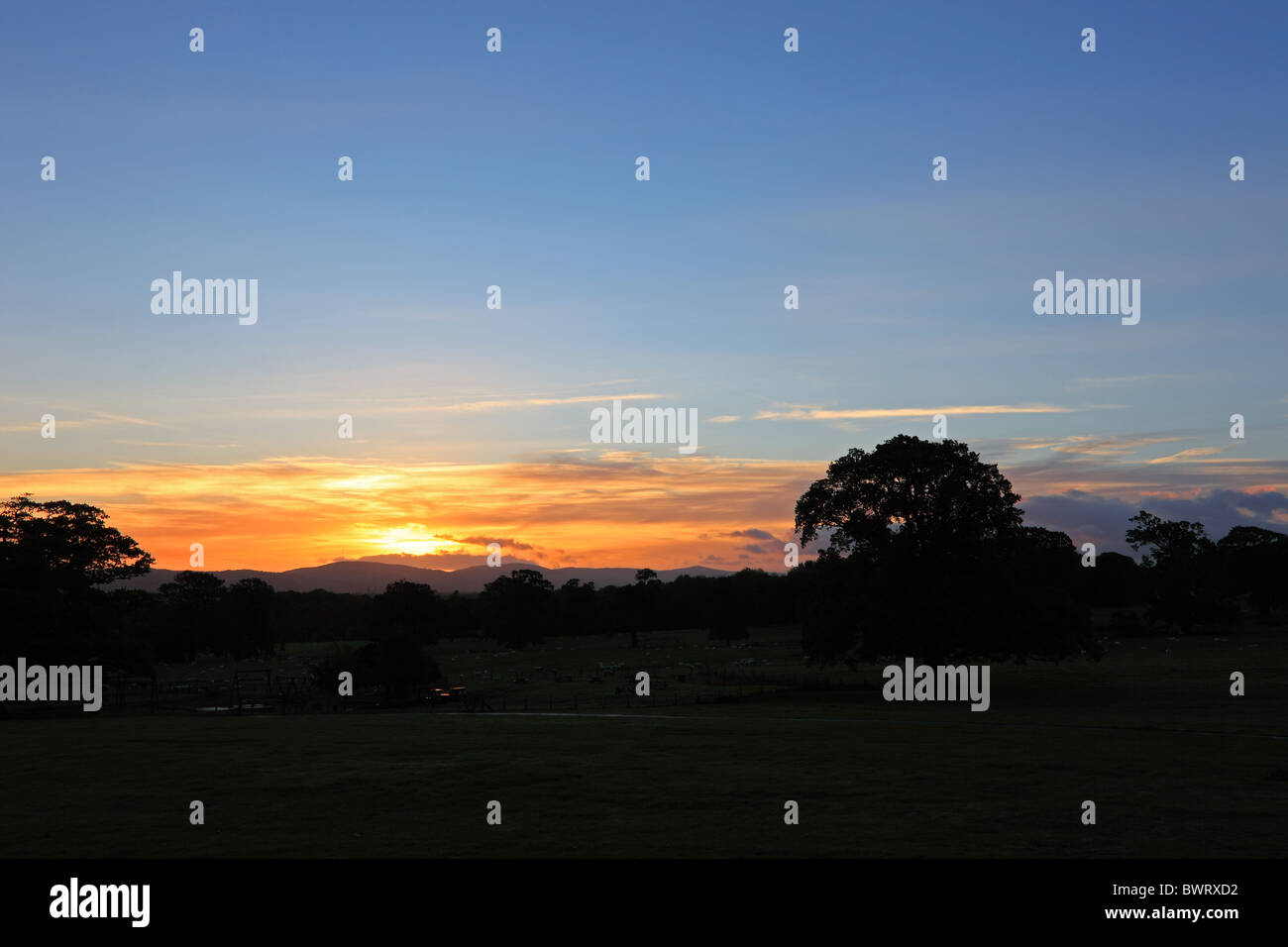 View across Vale of Clwyd to Clwydian Range of hills at sunrise. Stock Photo