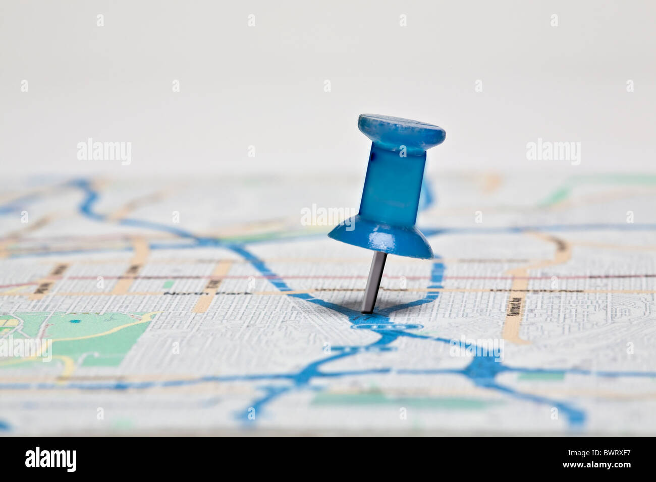 push pin in colorful map Stock Photo
