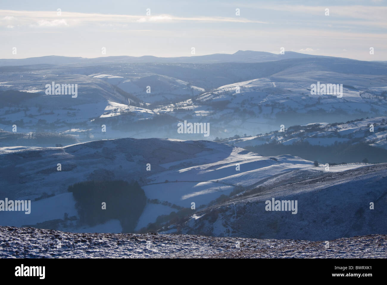 Looking at the Berwyn mountain range in winter from Moel y Gamelin, over the Vale of Llangollen, Wales, UK Stock Photo