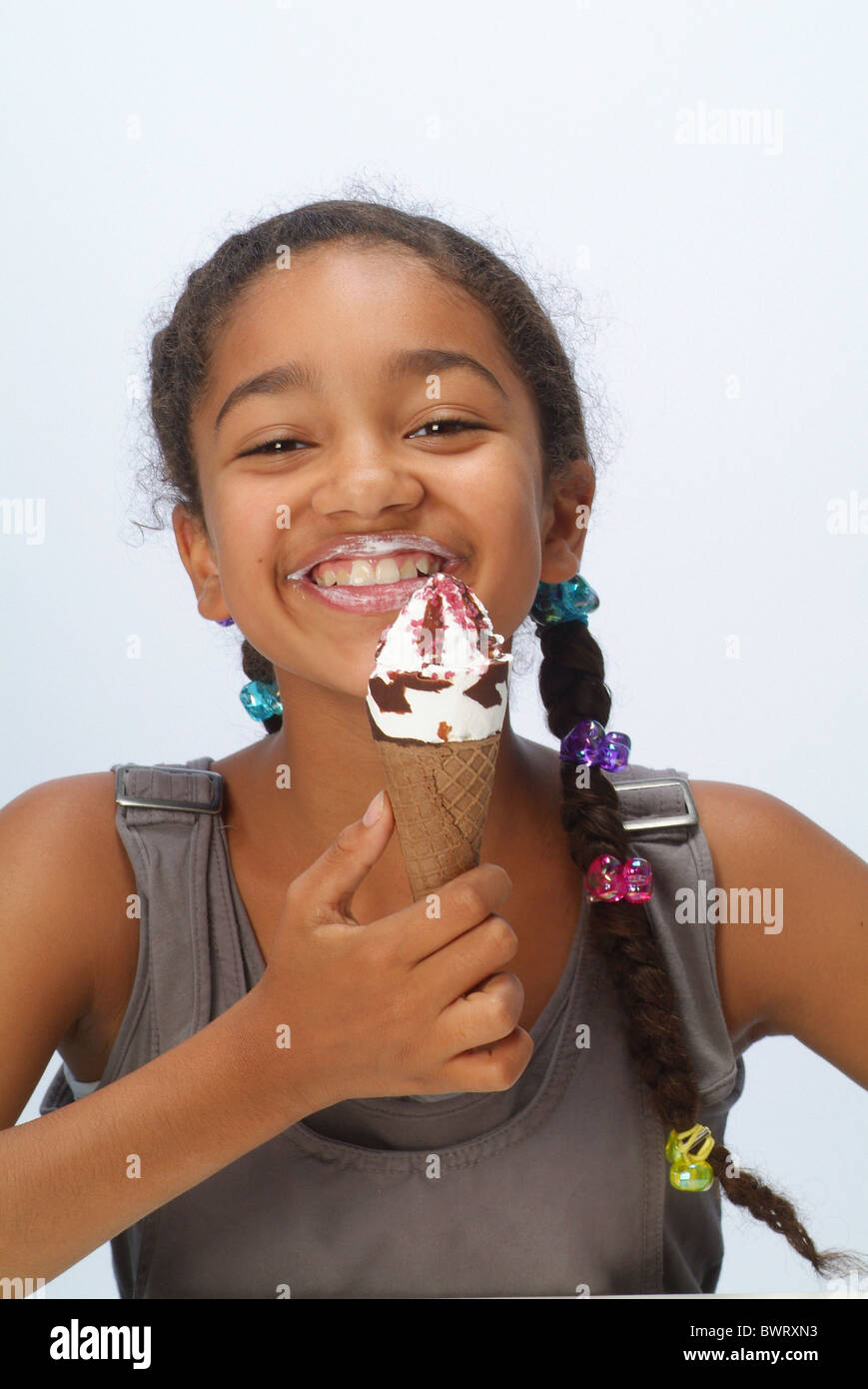 Young black girl licking lips hi-res stock photography and images - Alamy