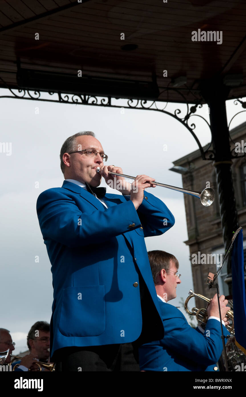 The Stacksteads Brass Band from Rossendale performing in Burnley town Centre in Lancashire England Stock Photo