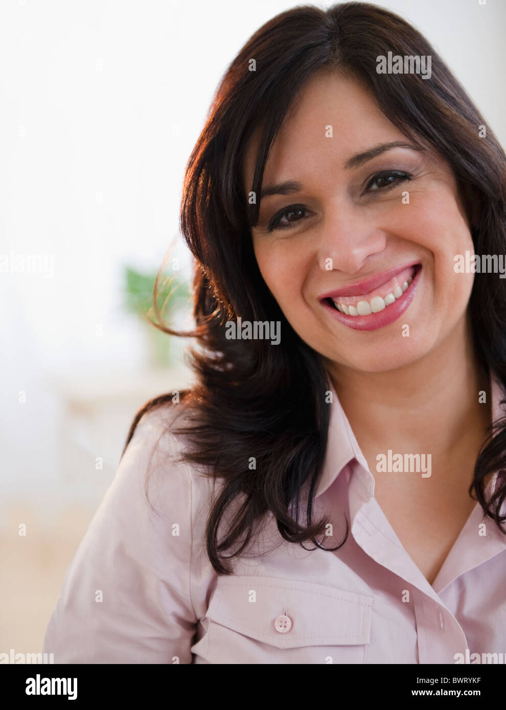 Portrait of smiling Hispanic woman Stock Photo - Alamy
