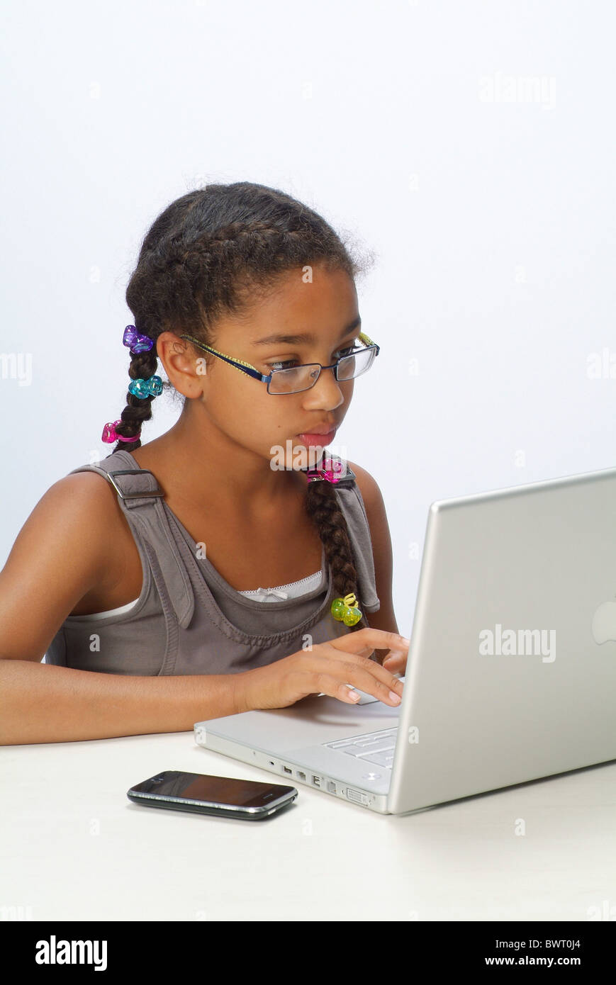 Portrait of a girl with a laptop and an iPhone Stock Photo
