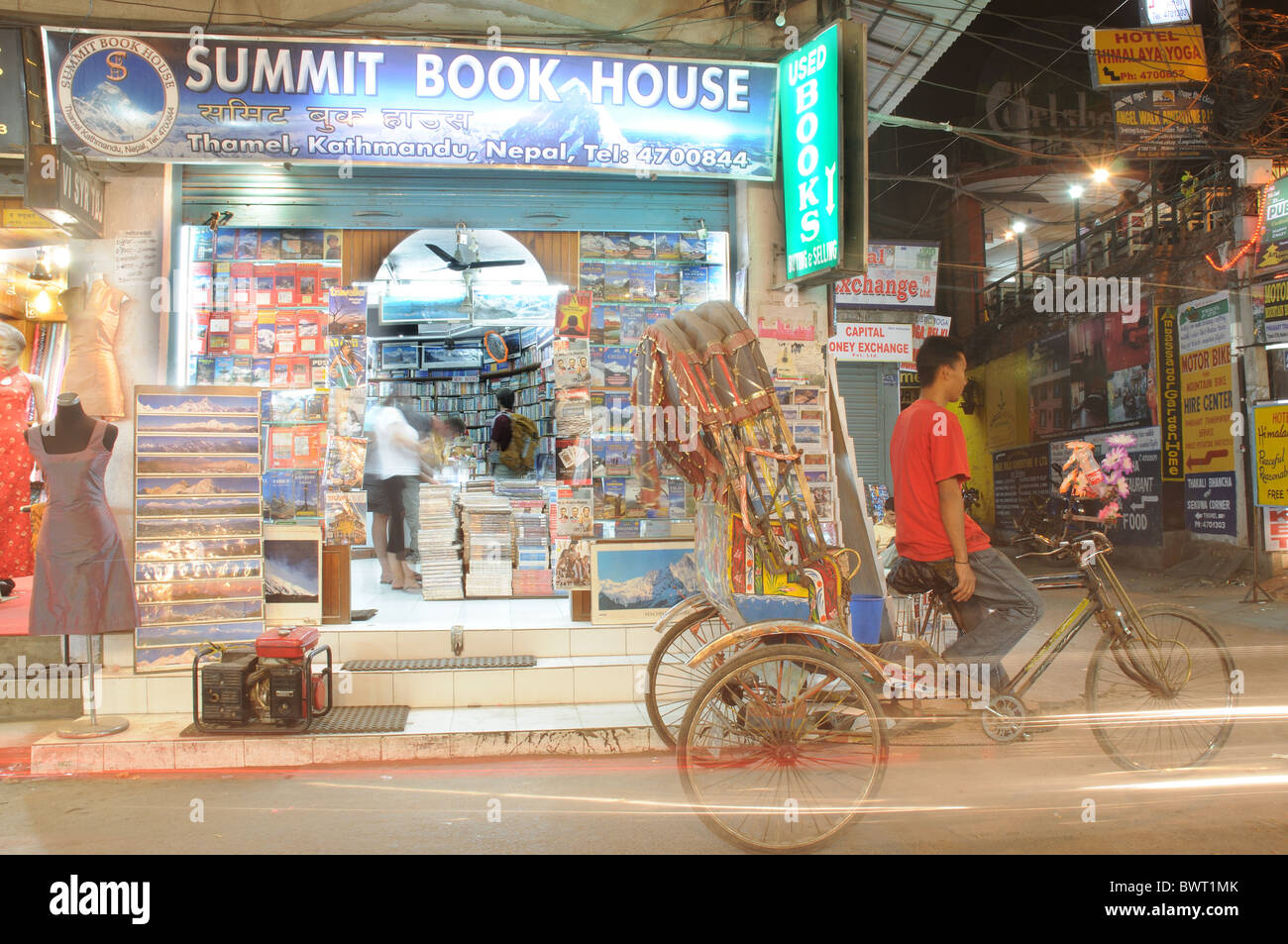 A rickshaw waiting outside a bookshop in Thamel, Kathmandu in Nepal Stock Photo