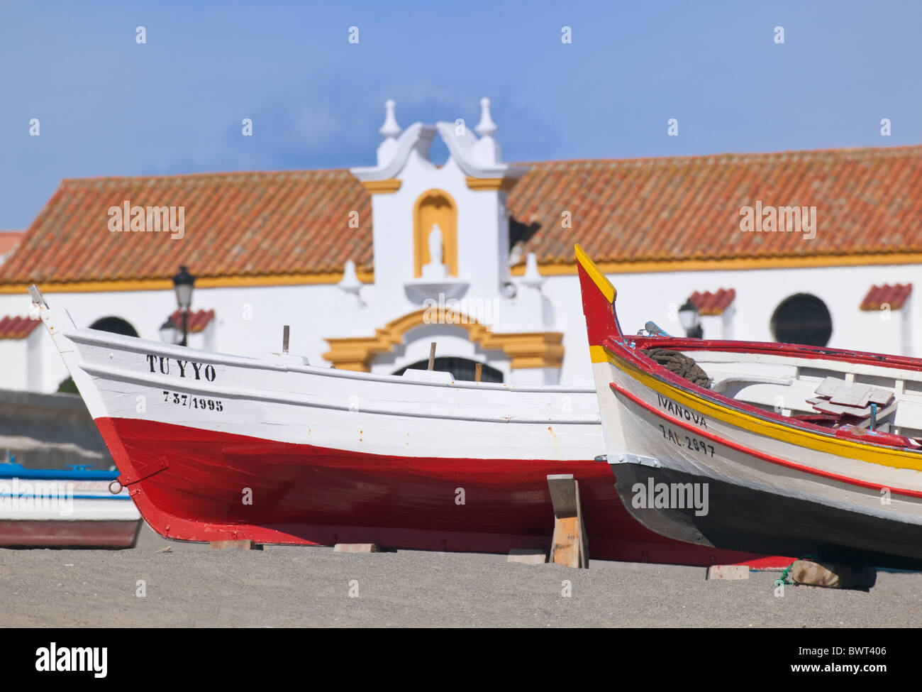 La Linea de la Concepcion, Cadiz Province, Spain. Fishing boats on beach and Parroquial church of Nuestra Senora del Carmen. Stock Photo