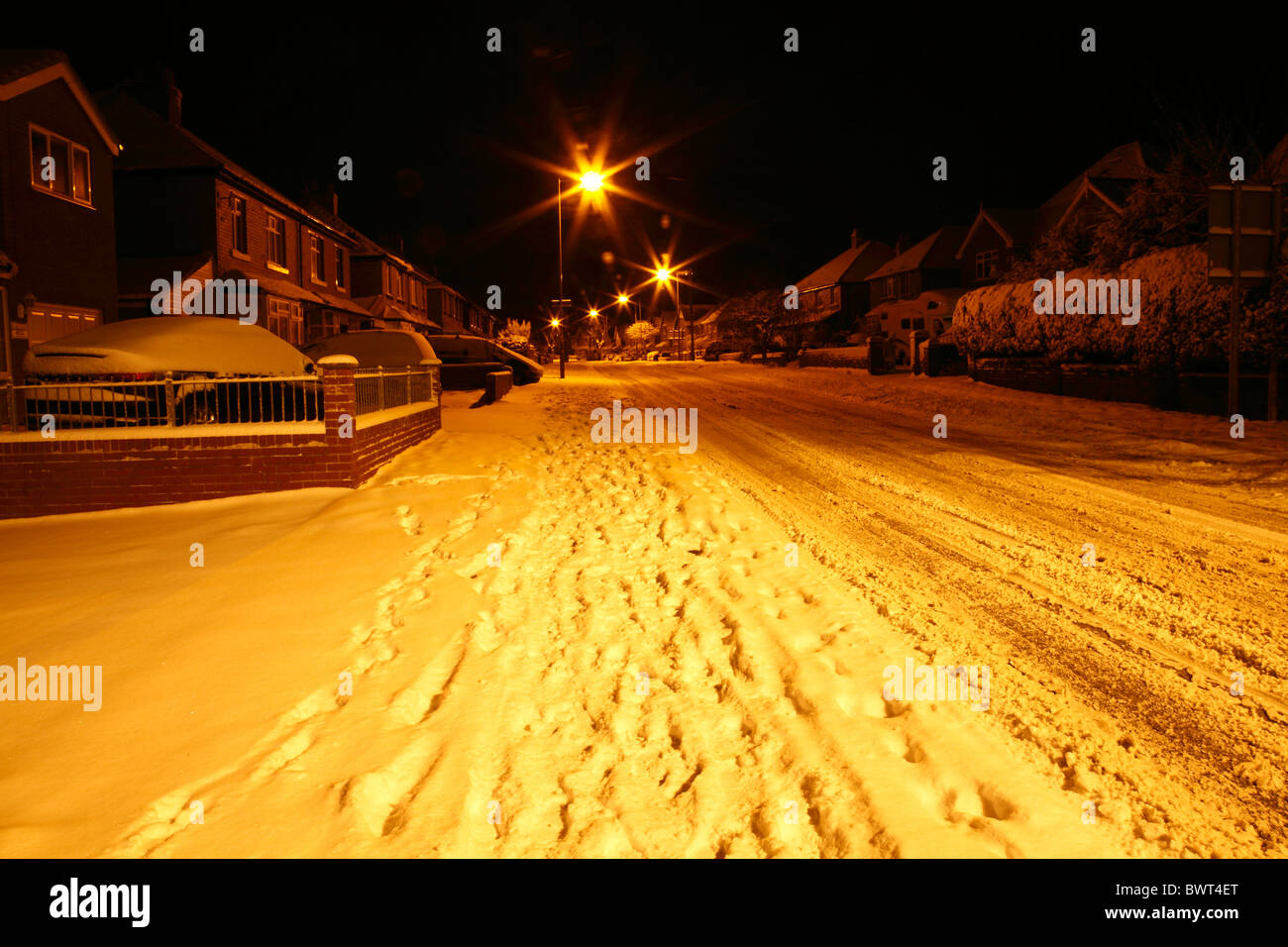 nigh time street covered in snow. Stock Photo