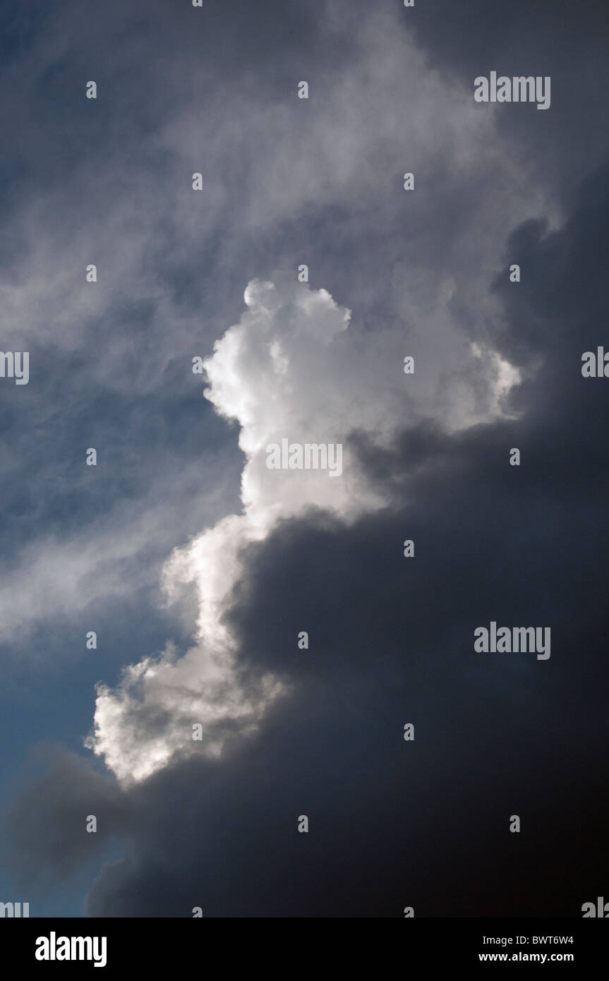 Rain threatening clouds with a cumulus cloud in the sky Stock Photo Alamy