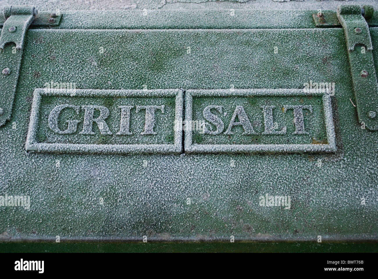 Roadside grit box with the words grit and salt covered in frost. Stock Photo