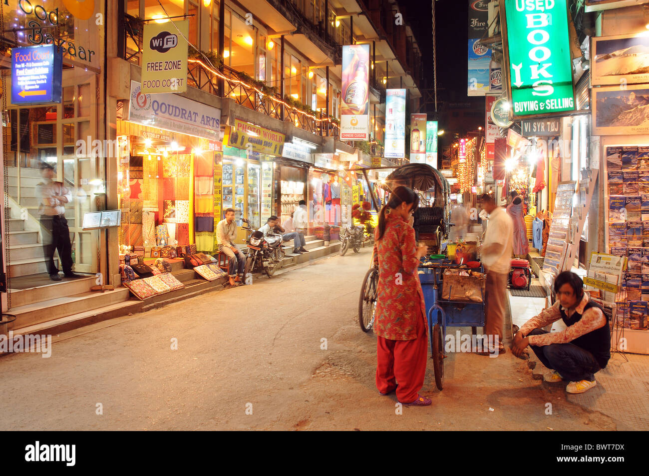 A Group Of Locals In The Street In Thamel In Kathmandu At Night Stock