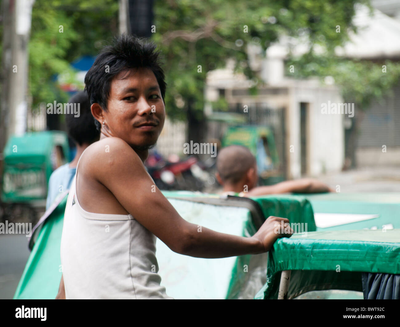 Tricycle driver Stock Photo