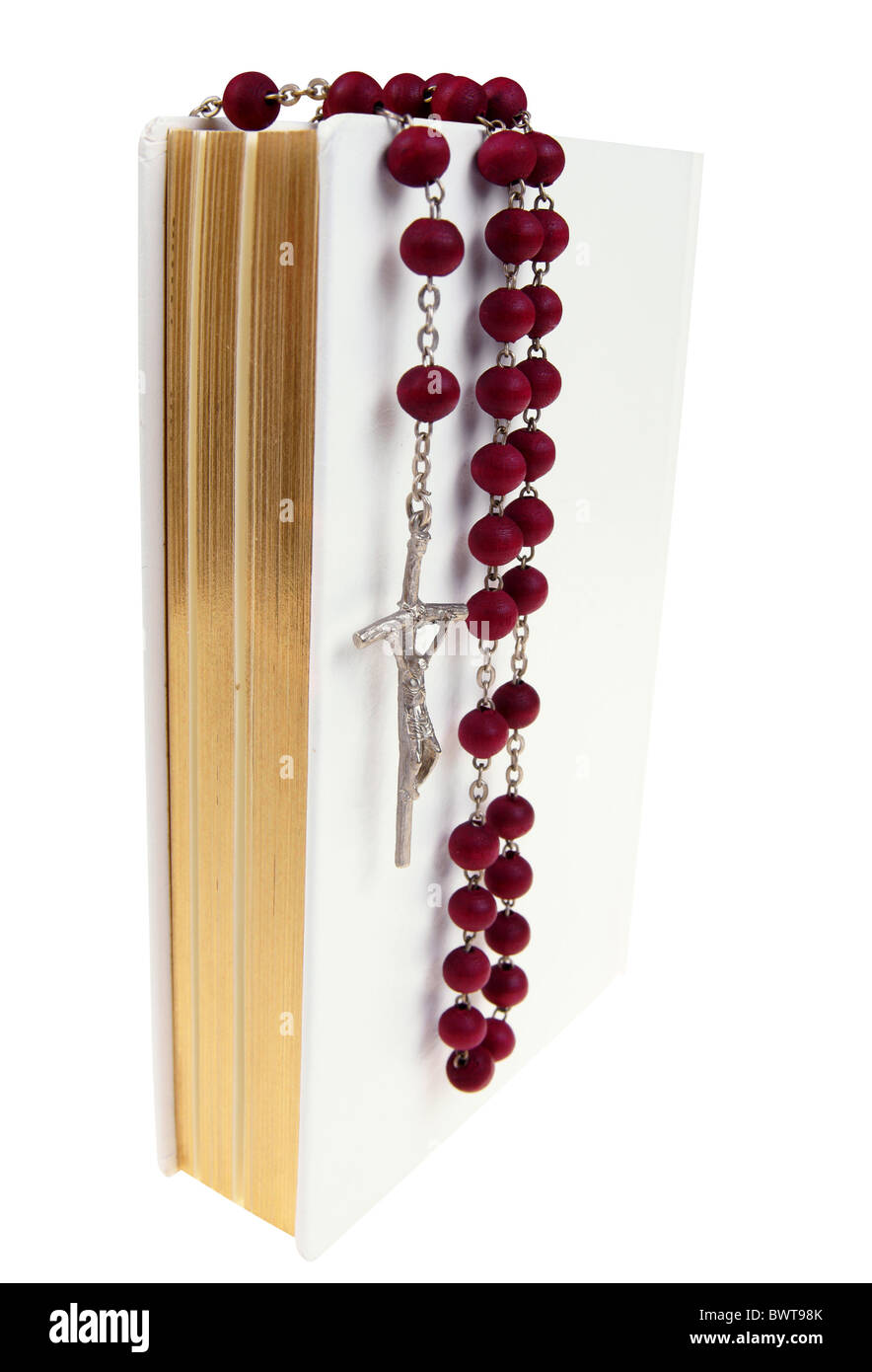 White prayer book with red rosary isolated on white background Stock Photo