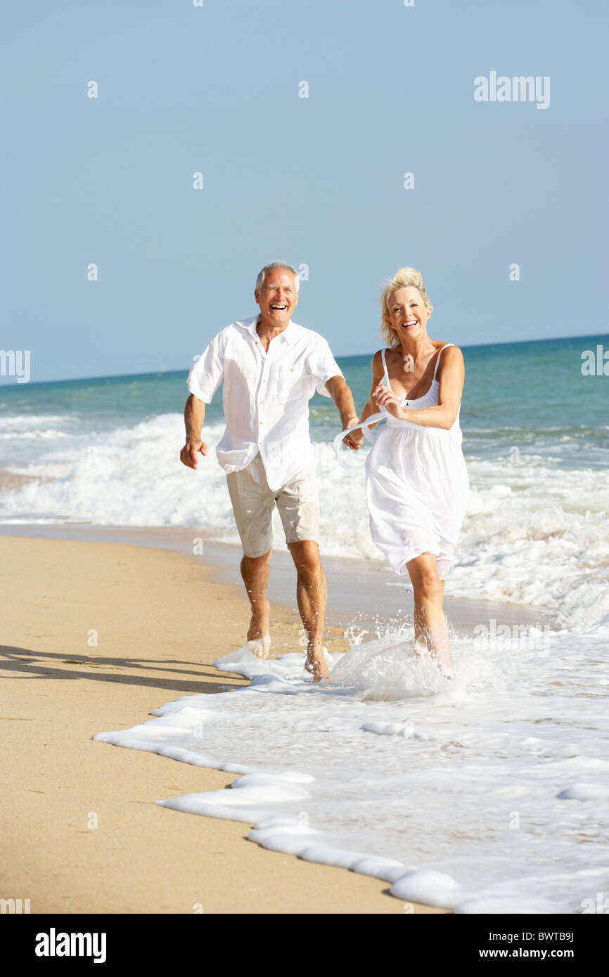 Senior Couple Enjoying Beach Holiday Stock Photo