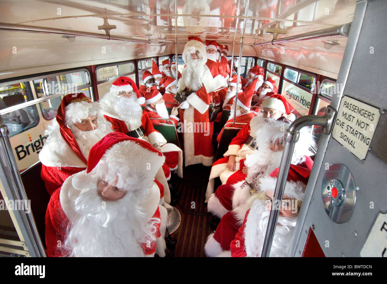 Members of the Brighton and Hove Bus Company staff prepare for the annual Santa Buses they run every Christmas. Stock Photo