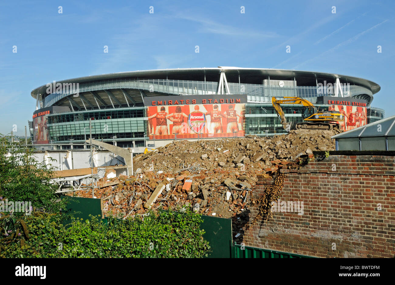Queensland Road Development Site with the Emirates Stadium in the background and rubble to the fore, Holloway London England UK Stock Photo