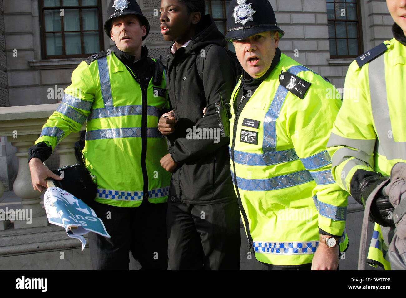 Police arresting black male protester Stock Photo