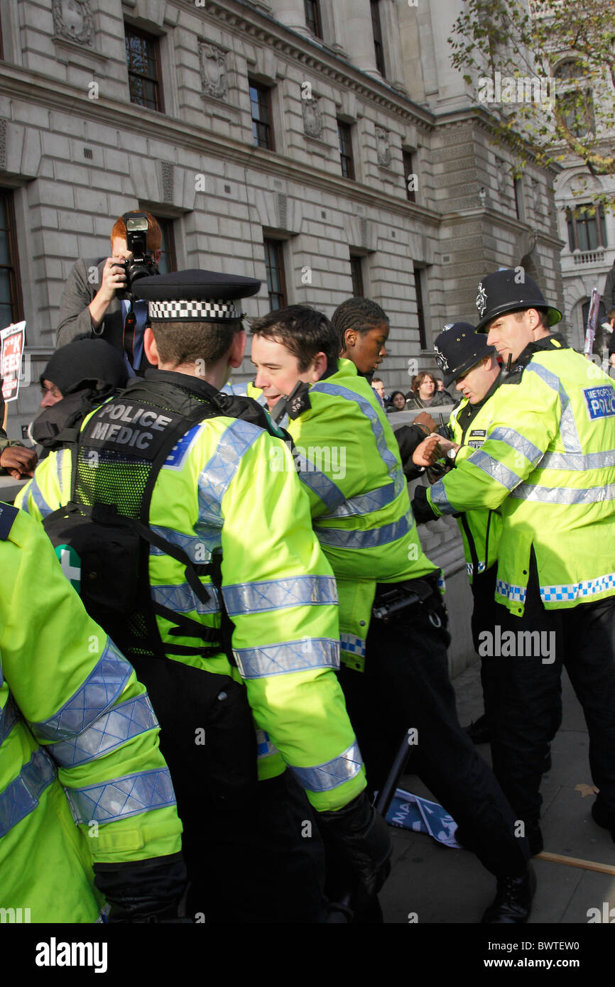 Student protest protesters riot rioting rioter rioters trouble disorder law lawful illegal legal demonstrate demonstrator cuts Stock Photo