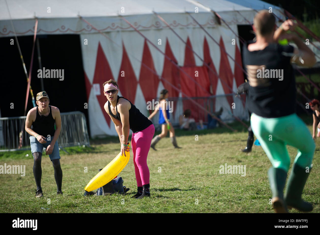 Music revelers gather for an impromptu game of cricket with an ...