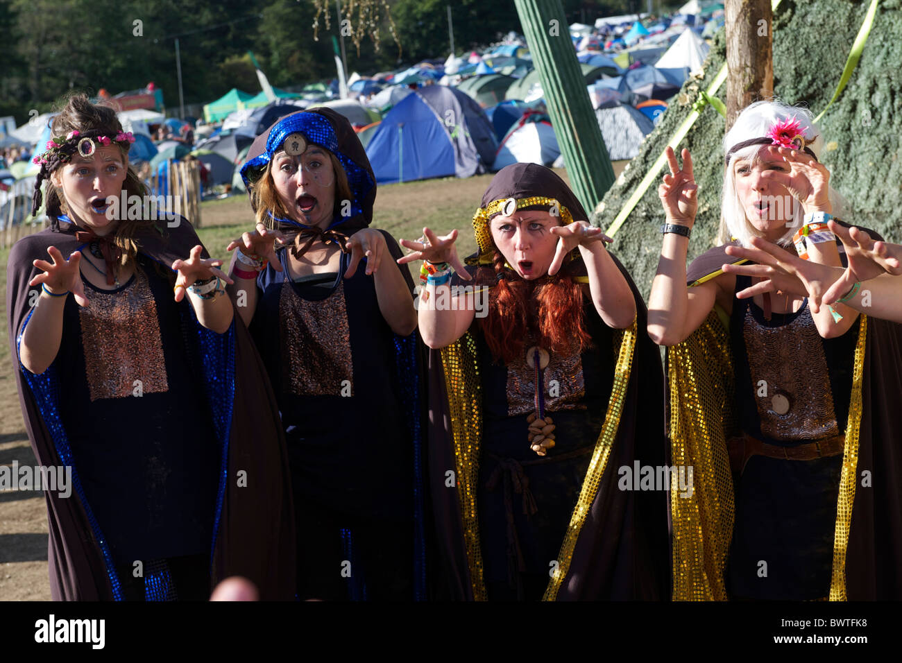 Gypsy dressed performers entertain a crowd on the final day of Bestival 2010 in Newport, Isle of Wight, England on September Stock Photo