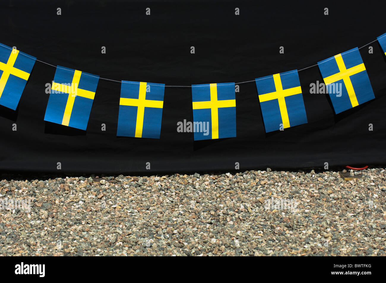 Swedish flags in a row Stock Photo