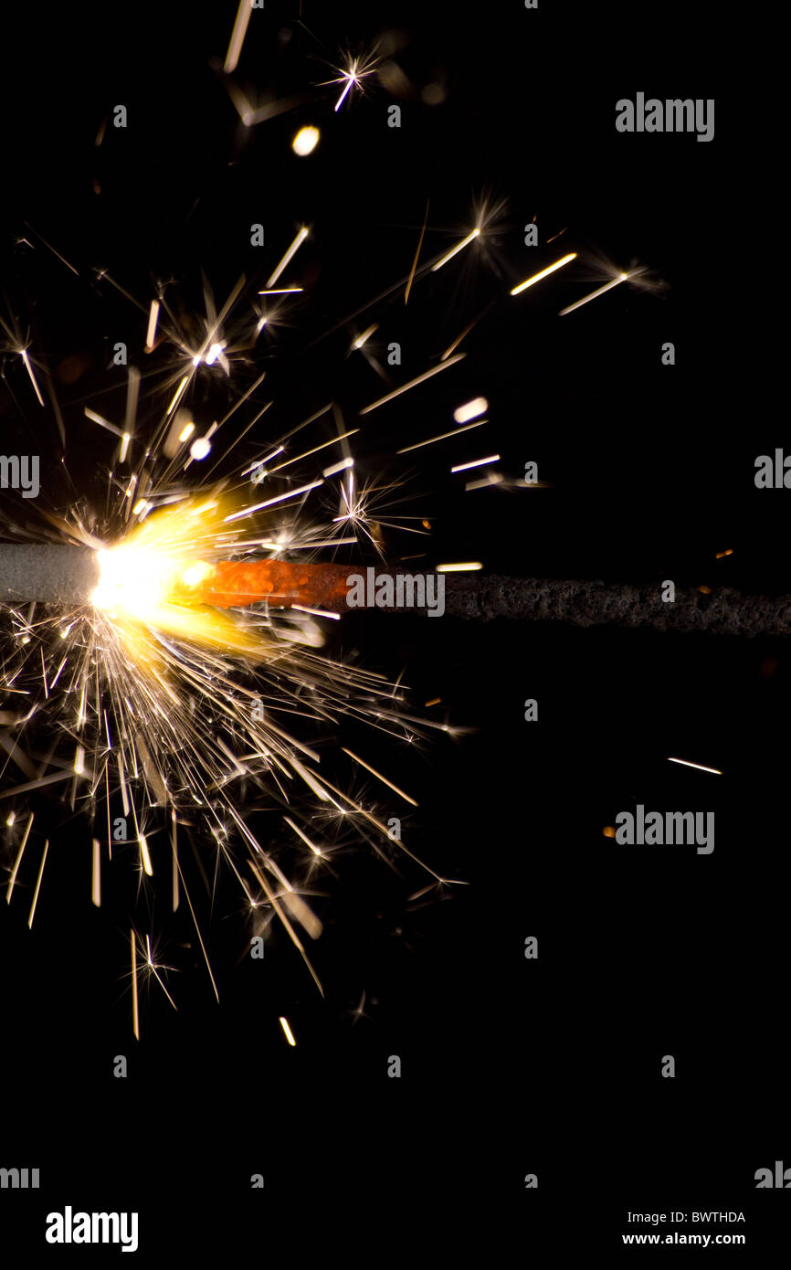The picture shows a sparkler on black background . Stock Photo