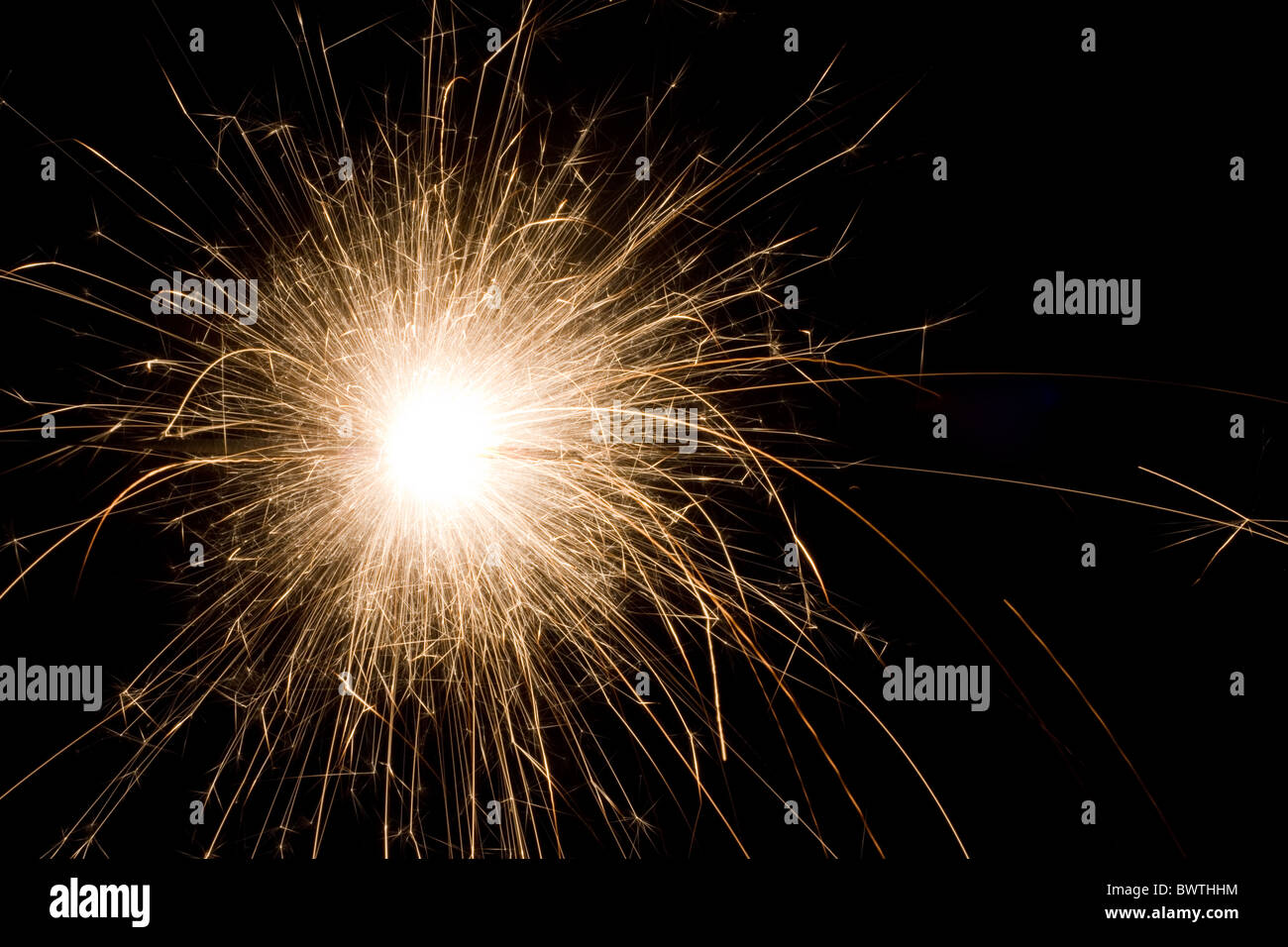 The picture shows a sparkler on black background . Stock Photo