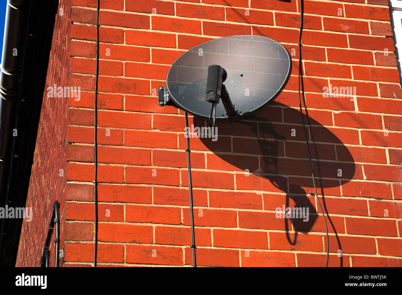 Satellite Dish Fixed To A House Stock Photo