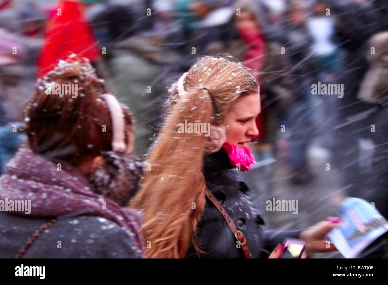 Female demonstrators brave the snow during student protest against tuition fees Stock Photo