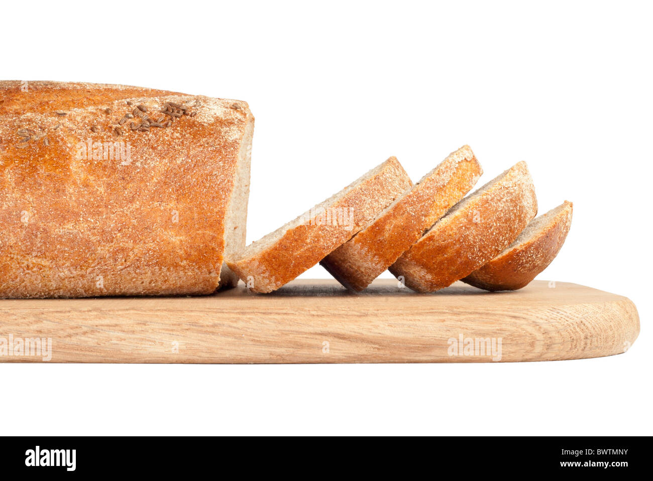 Sliced bread on a wooden chopping board isolated on white Stock Photo