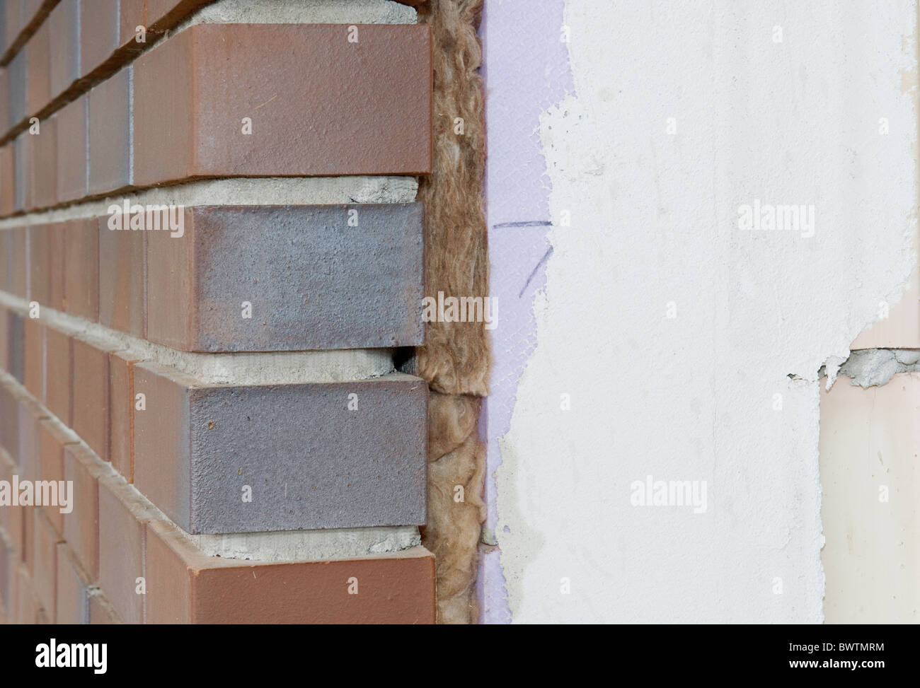 Thermal insulation of a brick wall Stock Photo