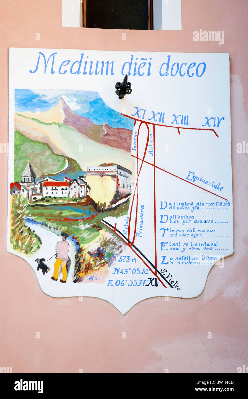 Sun dial showing when midday is "medium diei docco", Exilles, Piemonte, Italy Stock Photo