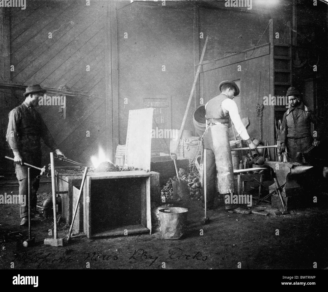 Workers factory blacksmith forger men Afro-american Afro-americans Newport ca. 1900 historical historic his Stock Photo