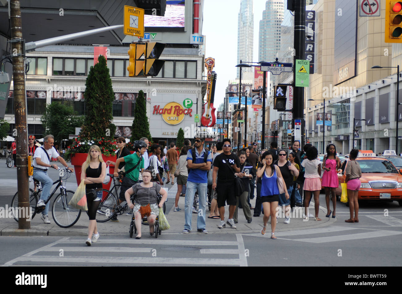 Diversity in full glory, on the move on a sunny day at Yonge Dundas Square, Toronto, Canada Stock Photo