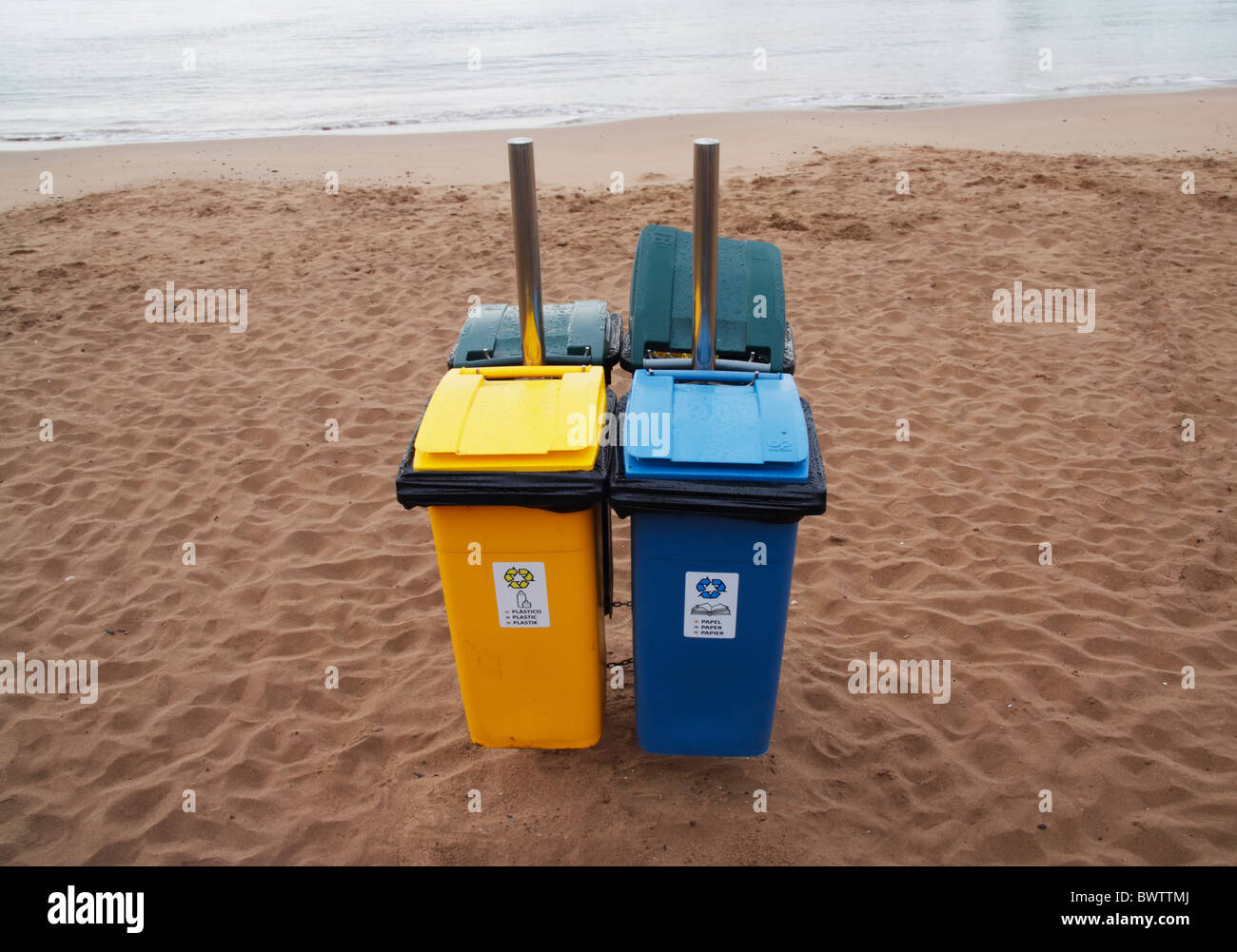 Recycling bins on beach in Spain Stock Photo Alamy