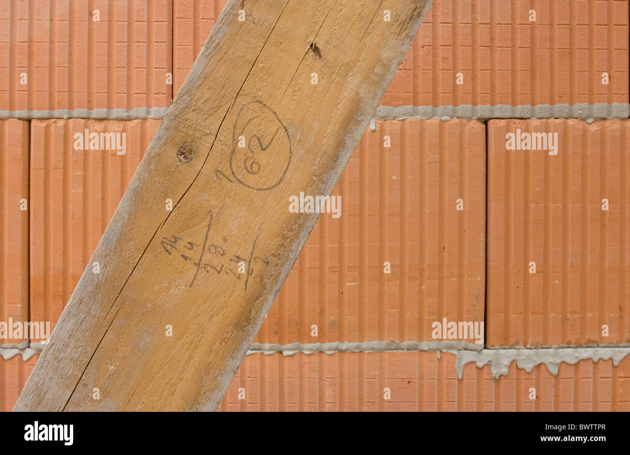 Hollow brick masonry with board Stock Photo
