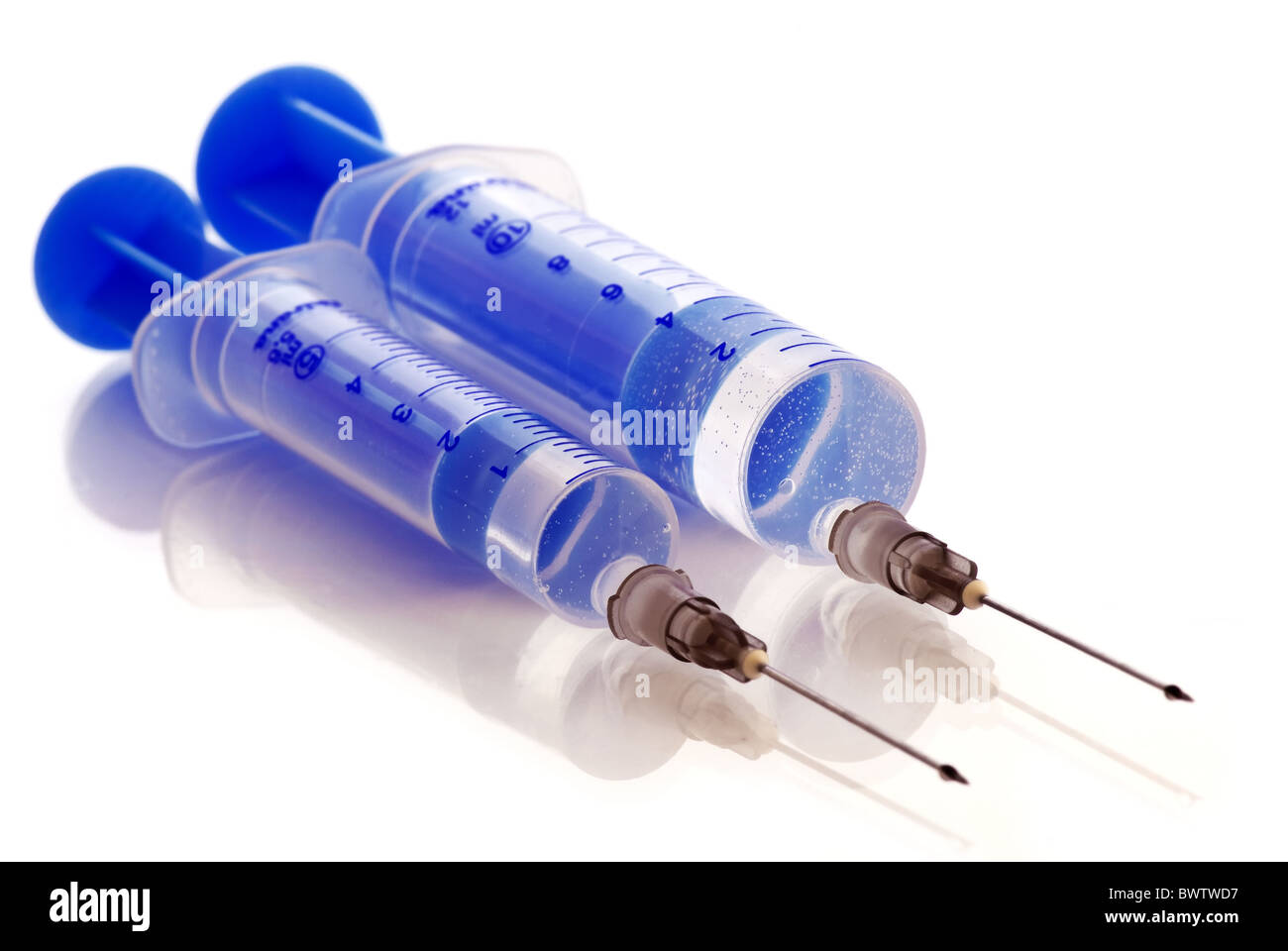 2 blue injections as closeup on white background Stock Photo