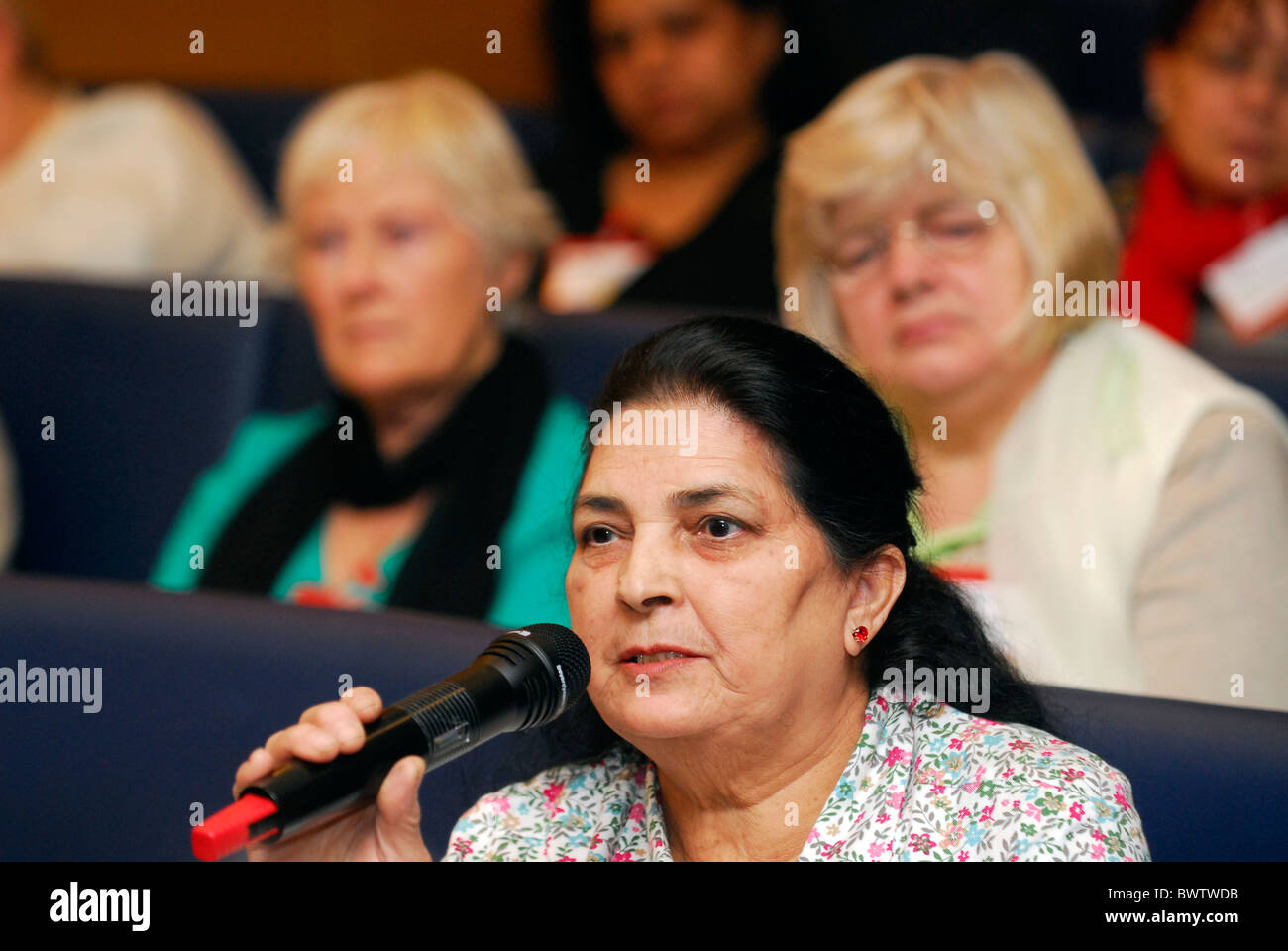 Female delegate public speaking at a conference about caring for dependents, November 2010, London, UK. Stock Photo