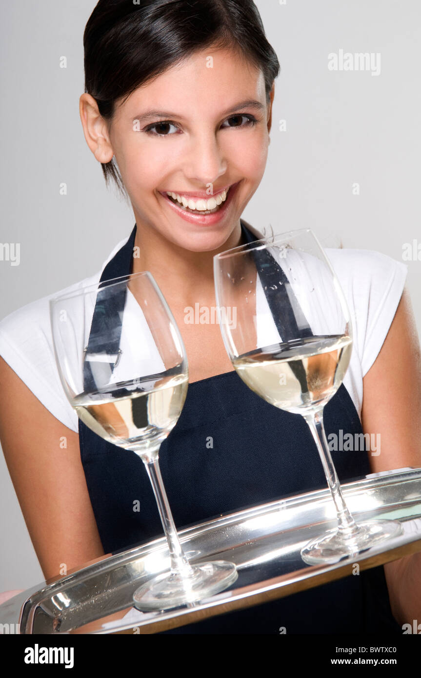 Waitress carrying tray with two glasses of wine Stock Photo Alamy