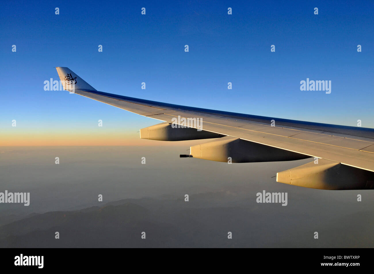 Airplane wing logo Emirates airplane travel winglet wingtip aviation jet air liner tourism Arabia United A Stock Photo